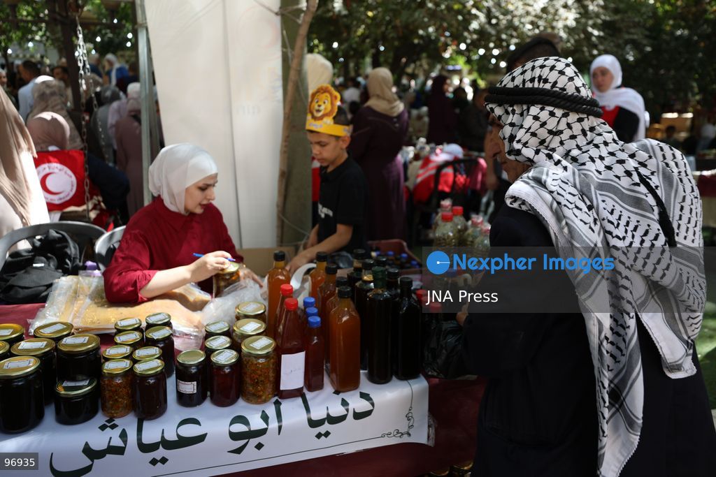 HEBRON, OCCUPIED WEST BANK, SEPTEMBER 26, 2026: Palestinian visitors attend the opening of a grape market in the Old City of Hebron. Local farmers and producers display grapes and grape-based products during the event, highlighting a crop traditionally associated with agriculture in the Hebron area. Photo by Mosab Shawer / JNA Press. (Photo by Mosab shawer/JNA Press via Nexpher Images)