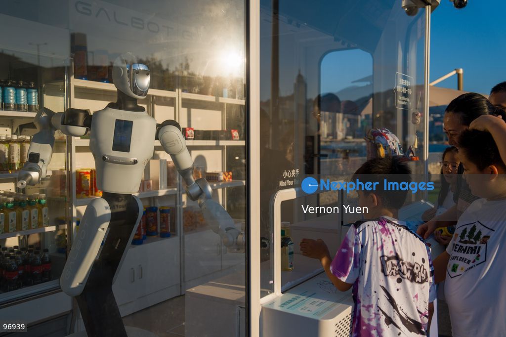 People buying goods from a robot operating a convenience store on September 26, 2026 in Hong Kong. (Photo by Vernon Yuen/Nexpher Images)