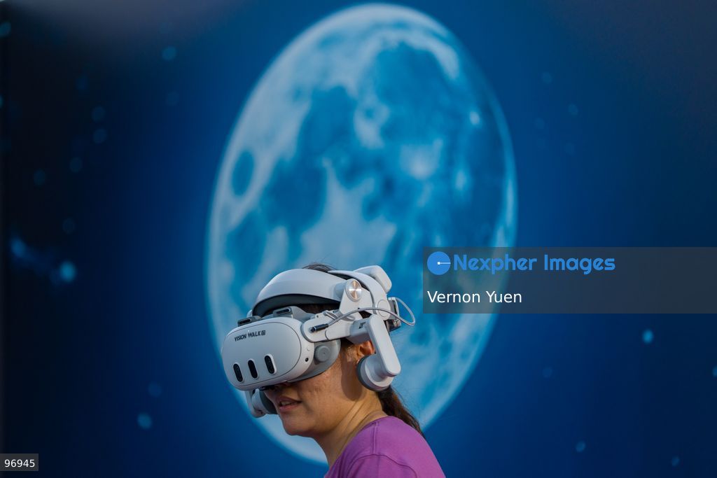 A woman wearing a VR headset on September 26, 2026 in Hong Kong. (Photo by Vernon Yuen/Nexpher Images)
