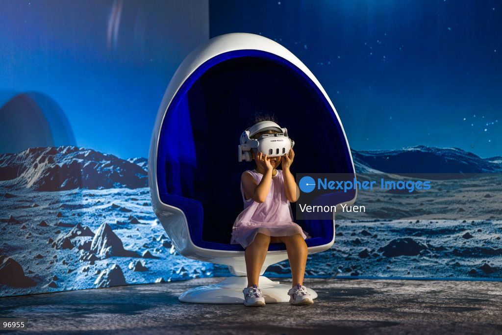 A girl wearing a VR headset on September 26, 2026 in Hong Kong. (Photo by Vernon Yuen/Nexpher Images)