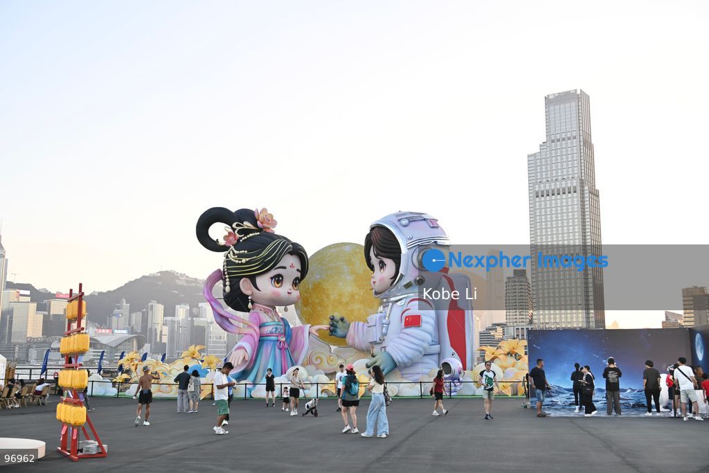Large illuminated figures depicting a traditional Hanfu and an astronaut are displayed during a nighttime event in Hung Hom New Waterfront, the day after the Mid-Autumn Festival on September 26, 2026 in Hong Kong. (Photo by Kobe Li/Nexpher Images)