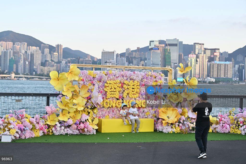 Visitors posing photo with decoration in Hung Hom New Waterfront, the day after the Mid-Autumn Festival on September 26, 2026 in Hong Kong. (Photo by Kobe Li/Nexpher Images)