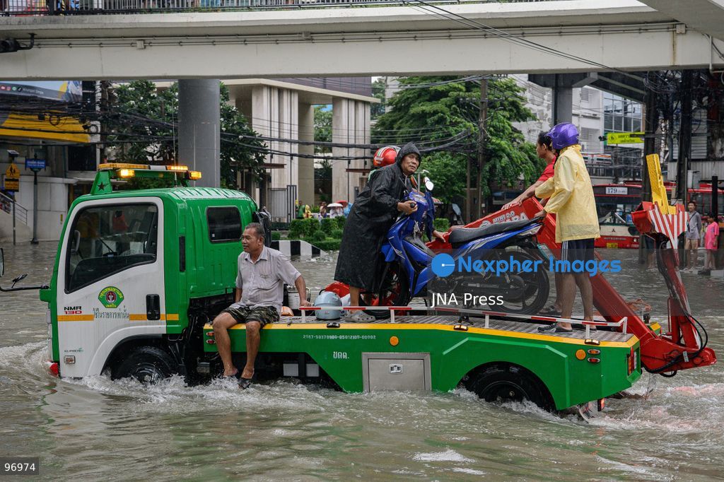 BANGKOK, THAILAND, SEPTEMBER 26, 2026: Residents navigate flooded streets amid persistent heavy rain in Bangkok, Thailand. Continuous rainfall since September 24 caused widespread flooding across the capital, with nearly 300 millimeters of rain recorded in some areas. Bangkok authorities declared all 50 districts disaster-affected as floodwaters disrupted roads and residential communities. More heavy rain was forecast through September 27. Photo by Watsawat Koktabtim (Photo by Watsawat Koktabtim/JNA Press via Nexpher Images)