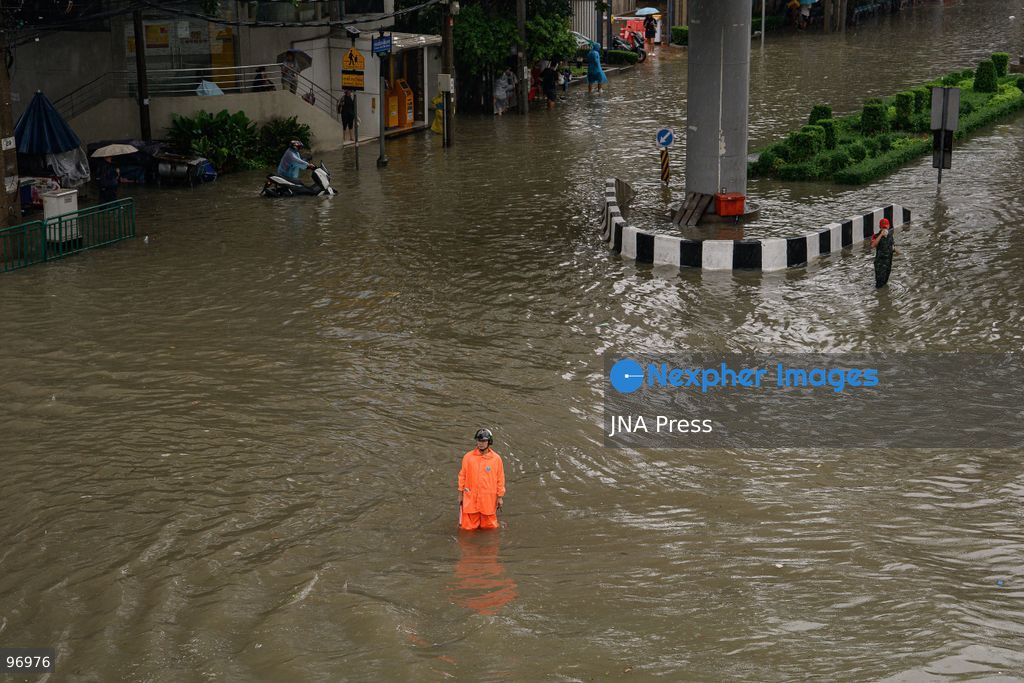 BANGKOK, THAILAND, SEPTEMBER 26, 2026: Residents navigate flooded streets amid persistent heavy rain in Bangkok, Thailand. Continuous rainfall since September 24 caused widespread flooding across the capital, with nearly 300 millimeters of rain recorded in some areas. Bangkok authorities declared all 50 districts disaster-affected as floodwaters disrupted roads and residential communities. More heavy rain was forecast through September 27. Photo by Watsawat Koktabtim (Photo by Watsawat Koktabtim/JNA Press via Nexpher Images)