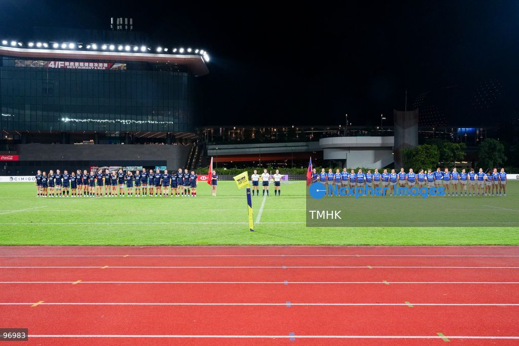 Players of Hong Kong, China and Samoa line up on the pitch during the national anthem ceremony ahead of their third-round clash at the WXV 3 global rugby tournament at Kai Tak Youth Sports Ground on September 26, 2026 in Hong Kong. The match took place after a five-hour delay triggered by extreme heat safety protocols, which also led to the cancellation of the subsequent fixture between Spain and Brazil. (Photo by Zulu Lo/TMHK via Nexpher Images)