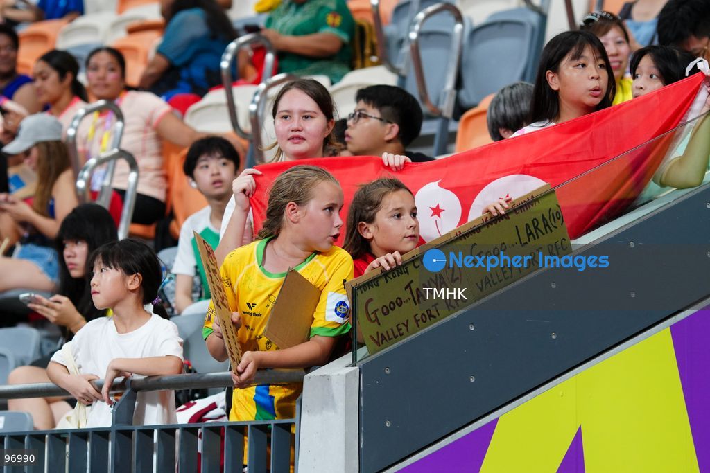 Spectators wave flags and cheer from the stands during the WXV 3 rugby tournament match between Hong Kong, China and Samoa at Kai Tak Youth Sports Ground on September 26, 2026 in Hong Kong. Despite high temperatures and a five-hour schedule delay, passionate fans filled the venue to support the home team in the tournament finale. (Photo by Zulu Lo/TMHK via Nexpher Images)