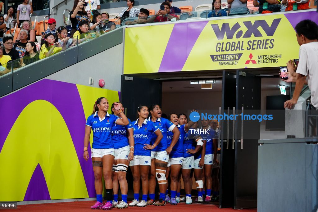 Players of Hong Kong, China and Samoa walk out of the tunnel and onto the pitch ahead of their WXV 3 global rugby tournament clash at Kai Tak Youth Sports Ground on September 26, 2026 in Hong Kong. The round three match commenced following a five-hour delay enforced under extreme heat safety guidelines, which also caused the cancellation of the subsequent fixture between Spain and Brazil. (Photo by Zulu Lo/TMHK via Nexpher Images)