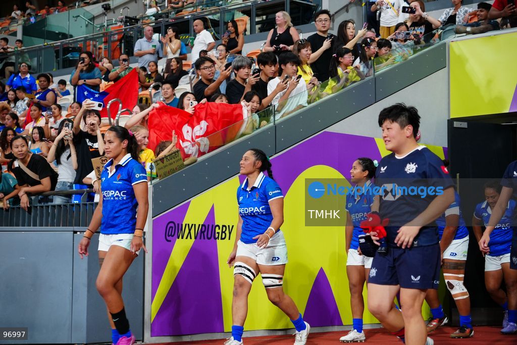 Players of Hong Kong, China and Samoa walk out of the tunnel and onto the pitch ahead of their WXV 3 global rugby tournament clash at Kai Tak Youth Sports Ground on September 26, 2026 in Hong Kong. The round three match commenced following a five-hour delay enforced under extreme heat safety guidelines, which also caused the cancellation of the subsequent fixture between Spain and Brazil. (Photo by Zulu Lo/TMHK via Nexpher Images)