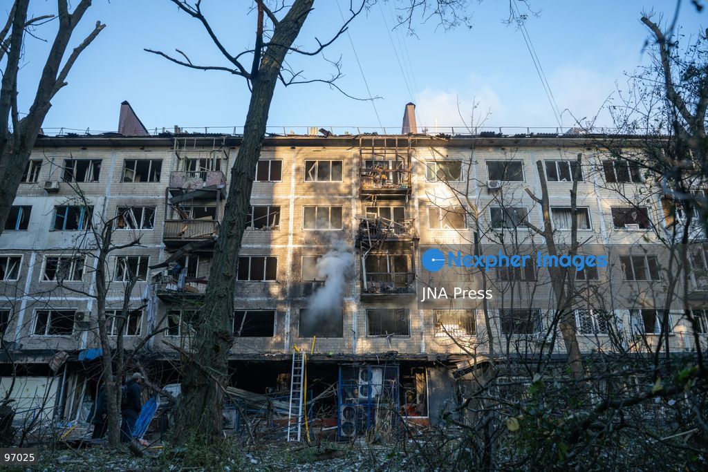 KYIV, UKRAINE, SEPTEMBER 26, 2026: Firefighters work at a five-story residential building damaged during a Russian drone attack in Kyiv’s Solomianskyi district, as residents watch emergency operations and clear shattered glass from the area. Kyiv authorities said a fire broke out at the residential building and a ground-floor shop following the fall of a drone, injuring four people and prompting rescuers to evacuate 20 residents. Photo by Nastasssia Torres / JNA Press. (Photo by Nastassia Kantorowicz Torres/JNA Press via Nexpher Images)