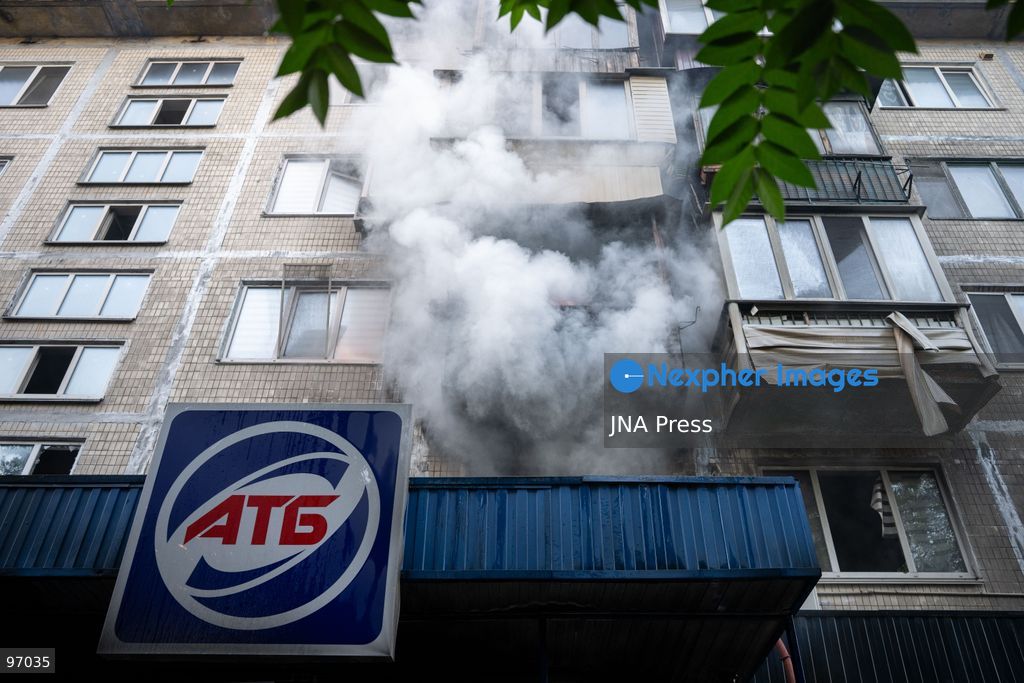 KYIV, UKRAINE, SEPTEMBER 26, 2026: Firefighters work at a five-story residential building damaged during a Russian drone attack in Kyiv’s Solomianskyi district, as residents watch emergency operations and clear shattered glass from the area. Kyiv authorities said a fire broke out at the residential building and a ground-floor shop following the fall of a drone, injuring four people and prompting rescuers to evacuate 20 residents. Photo by Nastasssia Torres / JNA Press. (Photo by Nastassia Kantorowicz Torres/JNA Press via Nexpher Images)