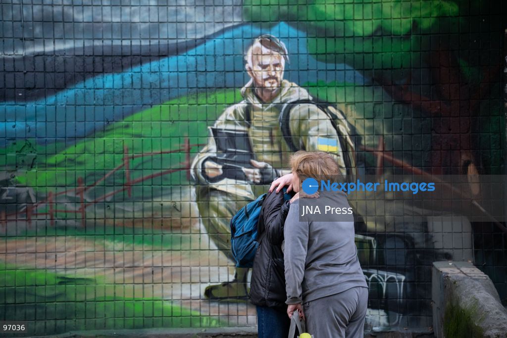 KYIV, UKRAINE, SEPTEMBER 26, 2026: Firefighters work at a five-story residential building damaged during a Russian drone attack in Kyiv’s Solomianskyi district, as residents watch emergency operations and clear shattered glass from the area. Kyiv authorities said a fire broke out at the residential building and a ground-floor shop following the fall of a drone, injuring four people and prompting rescuers to evacuate 20 residents. Photo by Nastasssia Torres / JNA Press. (Photo by Nastassia Kantorowicz Torres/JNA Press via Nexpher Images)