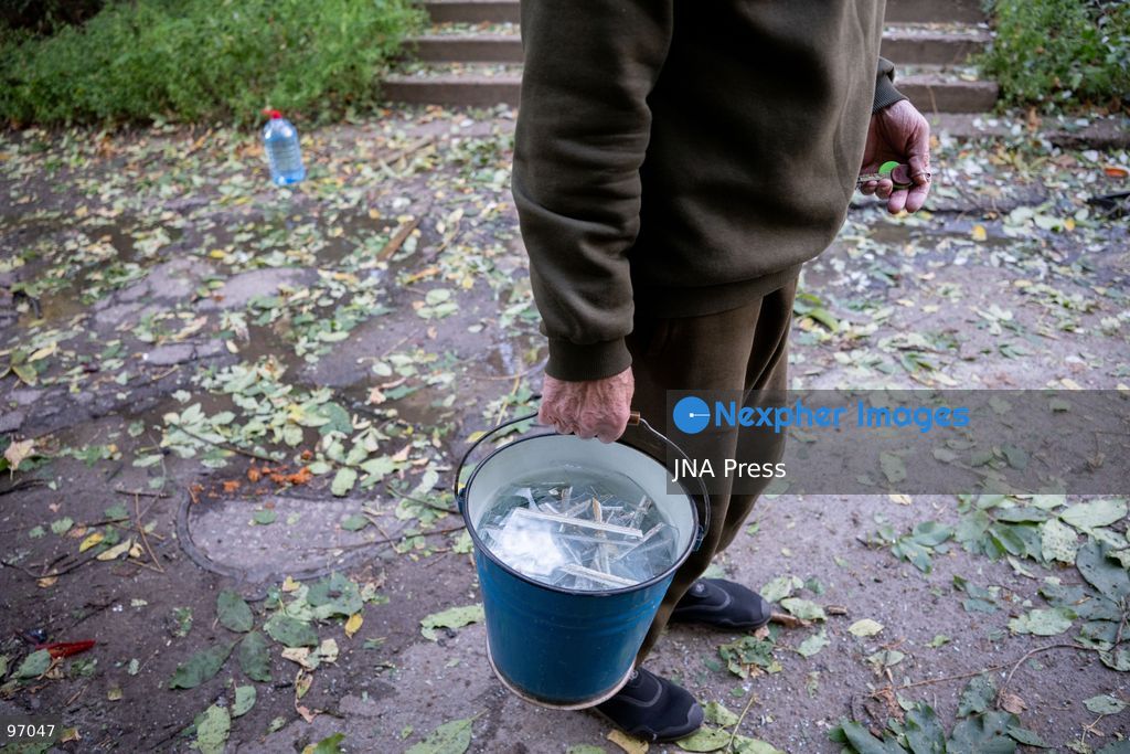 KYIV, UKRAINE, SEPTEMBER 26, 2026: Firefighters work at a five-story residential building damaged during a Russian drone attack in Kyiv’s Solomianskyi district, as residents watch emergency operations and clear shattered glass from the area. Kyiv authorities said a fire broke out at the residential building and a ground-floor shop following the fall of a drone, injuring four people and prompting rescuers to evacuate 20 residents. Photo by Nastasssia Torres / JNA Press. (Photo by Nastassia Kantorowicz Torres/JNA Press via Nexpher Images)