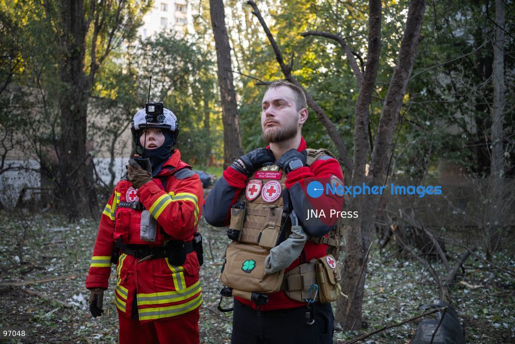 KYIV, UKRAINE, SEPTEMBER 26, 2026: Firefighters work at a five-story residential building damaged during a Russian drone attack in Kyiv’s Solomianskyi district, as residents watch emergency operations and clear shattered glass from the area. Kyiv authorities said a fire broke out at the residential building and a ground-floor shop following the fall of a drone, injuring four people and prompting rescuers to evacuate 20 residents. Photo by Nastasssia Torres / JNA Press. (Photo by Nastassia Kantorowicz Torres/JNA Press via Nexpher Images)