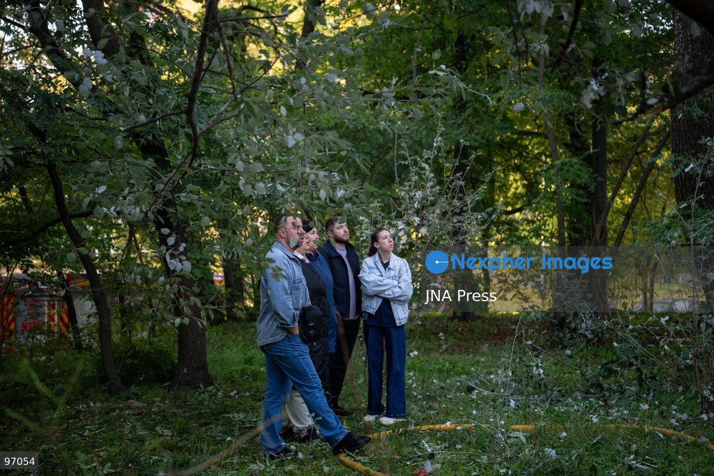 KYIV, UKRAINE, SEPTEMBER 26, 2026: Firefighters work at a five-story residential building damaged during a Russian drone attack in Kyiv’s Solomianskyi district, as residents watch emergency operations and clear shattered glass from the area. Kyiv authorities said a fire broke out at the residential building and a ground-floor shop following the fall of a drone, injuring four people and prompting rescuers to evacuate 20 residents. Photo by Nastasssia Torres / JNA Press. (Photo by Nastassia Kantorowicz Torres/JNA Press via Nexpher Images)