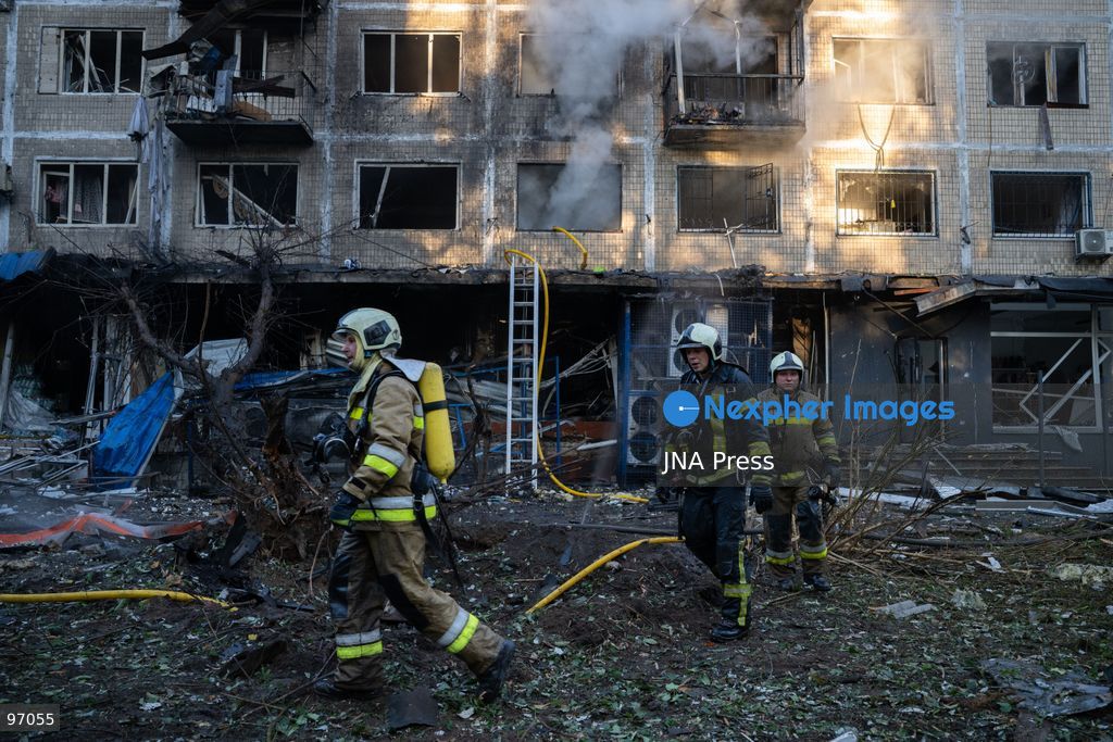 KYIV, UKRAINE, SEPTEMBER 26, 2026: Firefighters work at a five-story residential building damaged during a Russian drone attack in Kyiv’s Solomianskyi district, as residents watch emergency operations and clear shattered glass from the area. Kyiv authorities said a fire broke out at the residential building and a ground-floor shop following the fall of a drone, injuring four people and prompting rescuers to evacuate 20 residents. Photo by Nastasssia Torres / JNA Press. (Photo by Nastassia Kantorowicz Torres/JNA Press via Nexpher Images)
