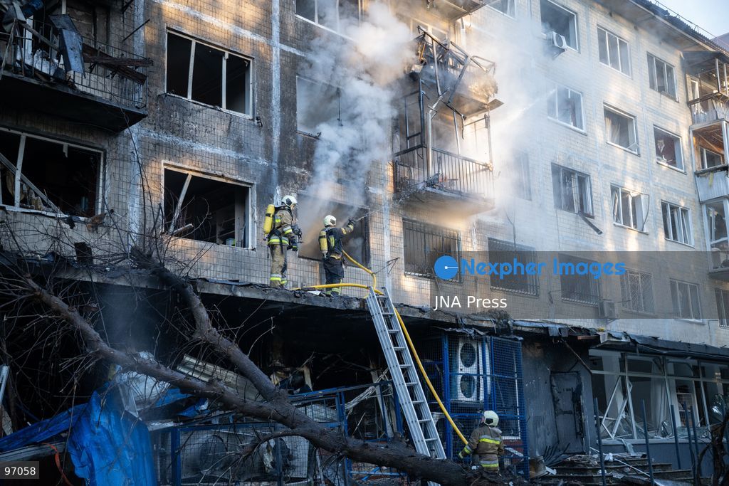 KYIV, UKRAINE, SEPTEMBER 26, 2026: Firefighters work at a five-story residential building damaged during a Russian drone attack in Kyiv’s Solomianskyi district, as residents watch emergency operations and clear shattered glass from the area. Kyiv authorities said a fire broke out at the residential building and a ground-floor shop following the fall of a drone, injuring four people and prompting rescuers to evacuate 20 residents. Photo by Nastasssia Torres / JNA Press. (Photo by Nastassia Kantorowicz Torres/JNA Press via Nexpher Images)