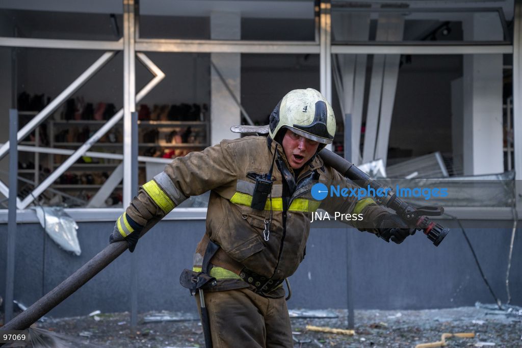KYIV, UKRAINE, SEPTEMBER 26, 2026: Firefighters work at a five-story residential building damaged during a Russian drone attack in Kyiv’s Solomianskyi district, as residents watch emergency operations and clear shattered glass from the area. Kyiv authorities said a fire broke out at the residential building and a ground-floor shop following the fall of a drone, injuring four people and prompting rescuers to evacuate 20 residents. Photo by Nastasssia Torres / JNA Press. (Photo by Nastassia Kantorowicz Torres/JNA Press via Nexpher Images)