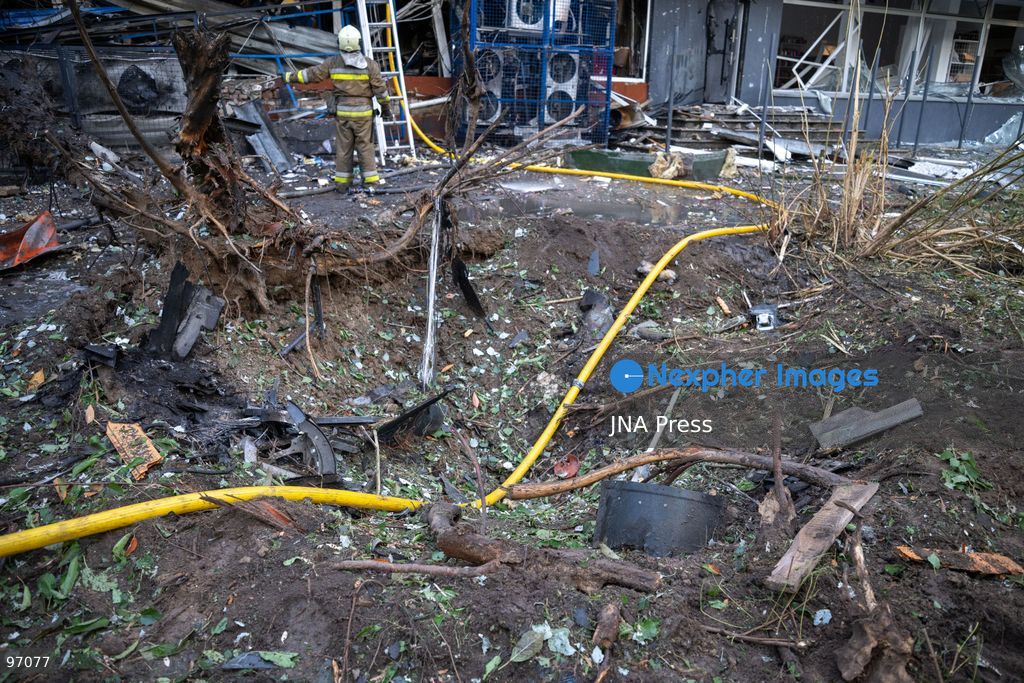 KYIV, UKRAINE, SEPTEMBER 26, 2026: Firefighters work at a five-story residential building damaged during a Russian drone attack in Kyiv’s Solomianskyi district, as residents watch emergency operations and clear shattered glass from the area. Kyiv authorities said a fire broke out at the residential building and a ground-floor shop following the fall of a drone, injuring four people and prompting rescuers to evacuate 20 residents. Photo by Nastasssia Torres / JNA Press. (Photo by Nastassia Kantorowicz Torres/JNA Press via Nexpher Images)