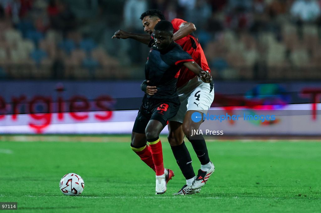 CAIRO, EGYPT, SEPTEMBER 25, 2026: 4 Hossam Abdelmaguid of Egypt battle for possession with 23 MANUEL LUIS DA SILVA CAFUMANA of Angola during Africa Cup of Nations qualification Group B match between Egypt and Angola at Cairo International Stadium in 25 Sep 2026.Photo by Ayman Aref / JNA Press (Photo by Ayman Aref/JNA Press via Nexpher Images)