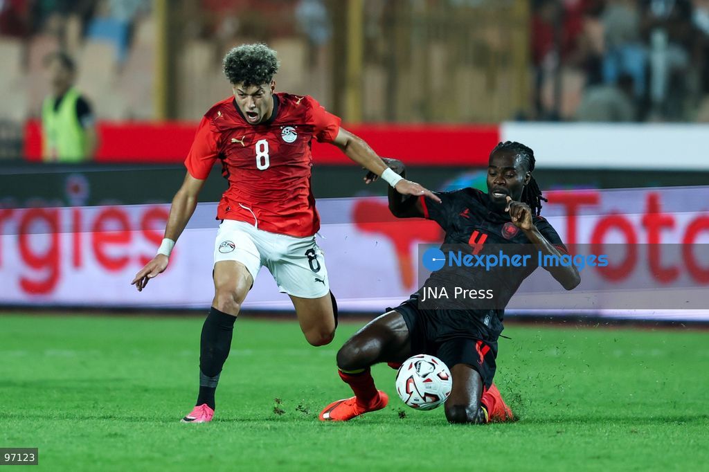 CAIRO, EGYPT, SEPTEMBER 25, 2026: 8 Emam Ashour of Egypt battle for possession with 4 JUNIOR MARSONI SAMBU MANSONI of Angola during Africa Cup of Nations qualification Group B match between Egypt and Angola at Cairo International Stadium in 25 Sep 2026.Photo by Ayman Aref / JNA Press (Photo by Ayman Aref/JNA Press via Nexpher Images)