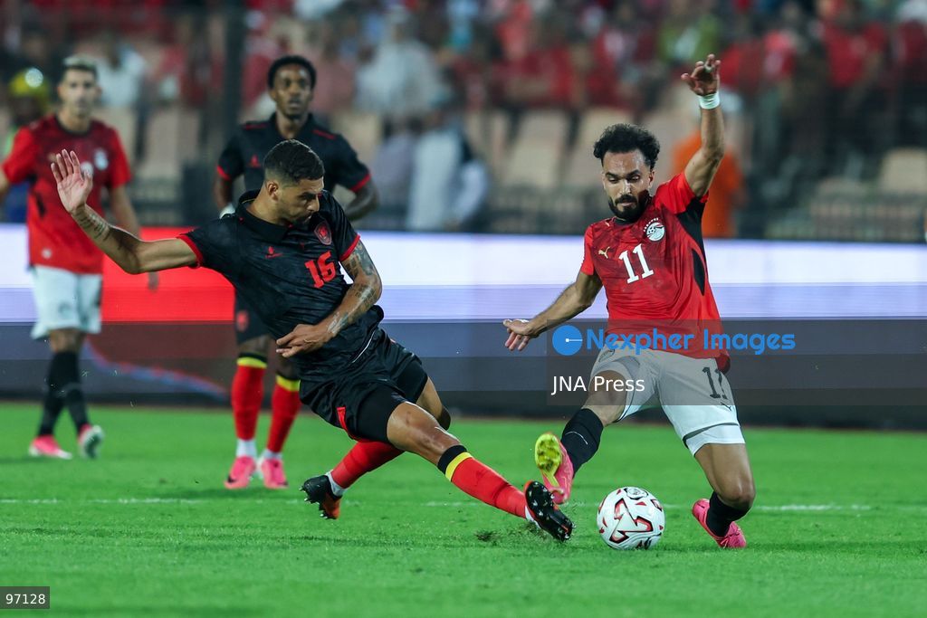 CAIRO, EGYPT, SEPTEMBER 25, 2026: 11 Mostafa Zico of Egypt battle for possession with 16 DAVID MOTA VEIGA TEIXEIRA DO CARMO of Angola during Africa Cup of Nations qualification Group B match between Egypt and Angola at Cairo International Stadium in 25 Sep 2026.Photo by Ayman Aref / JNA Press (Photo by Ayman Aref/JNA Press via Nexpher Images)