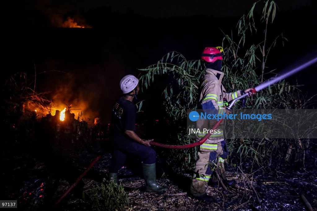 KARANGANYAR, CENTRAL JAVA, INDONESIA, SEPTEMBER 26, 2026: Firefighters work to extinguish a wildfire in Delingan, Karanganyar Regency, Central Java. Personnel from the Karanganyar Fire Department and the Regional Disaster Management Agency (BPBD) carried out firefighting operations to prevent the blaze from spreading toward nearby residential areas. Photo by Ilham Nur Arifin / JNA Press. (Photo by Ilham Nur Arifin/JNA Press via Nexpher Images)