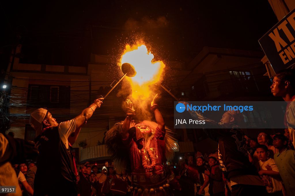 LALITPUR, NEPAL, SEPTEMBER 26, 2026: A performer takes part in the traditional Mipwa Lakhe dance at Gusingal Chowk in Lalitpur during celebrations for Indra Jatra. The Lakhe was taken in procession through several neighborhoods following the distribution of prasad to devotees at Hathu Dyo. The Mipwa Lakhe tradition is distinguished by a performance in which the masked dancer blows fire from a burning torch. Photo by Ghanashyam Shrestha / JNA Press. (Photo by Ghanashyam Shrestha/JNA Press via Nexpher Images)