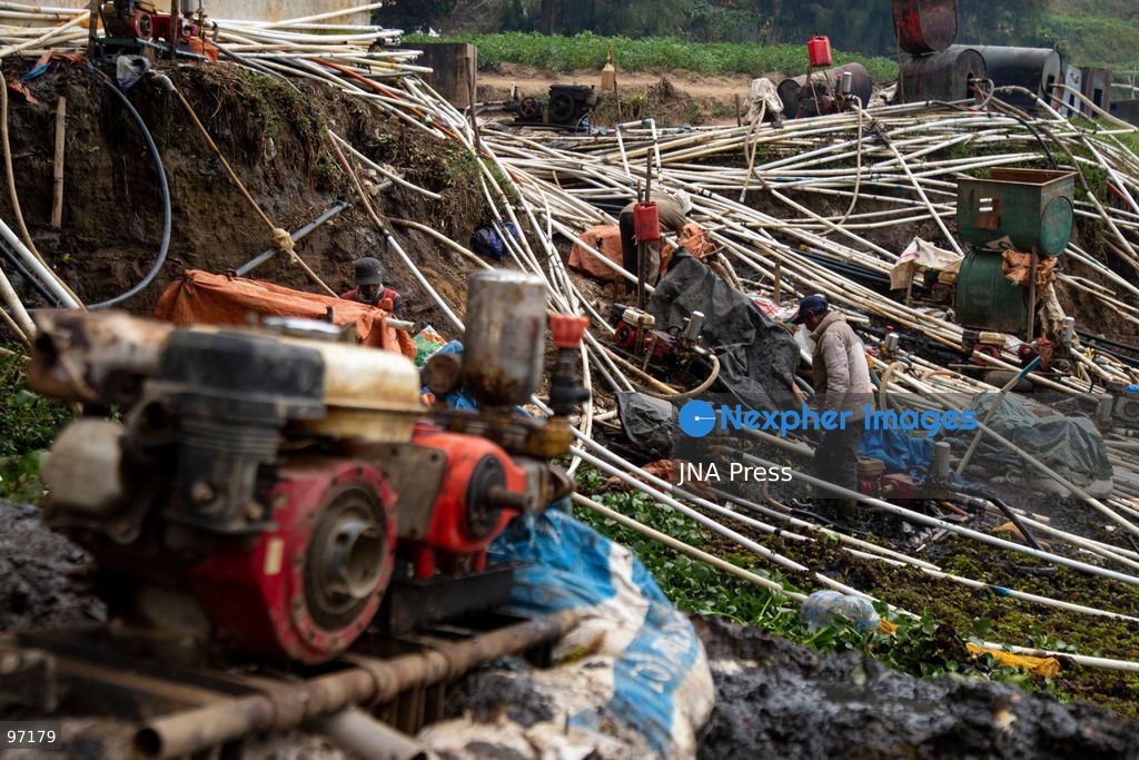 BANJARNEGARA, CENTRAL JAVA, INDONESIA, SEPTEMBER 26, 2026: Farmers use diesel-powered pumps and long hoses to draw water from Telaga Merdada for nearby farmland in Banjarnegara Regency, Central Java. The water level at the lake has dropped by approximately three meters over the past three months, increasing the need for farmers to pump water to irrigate agricultural land. Photo by Topen Anggara/ JNA Press. (Photo by Topen Anggara Saputra/JNA Press via Nexpher Images)
