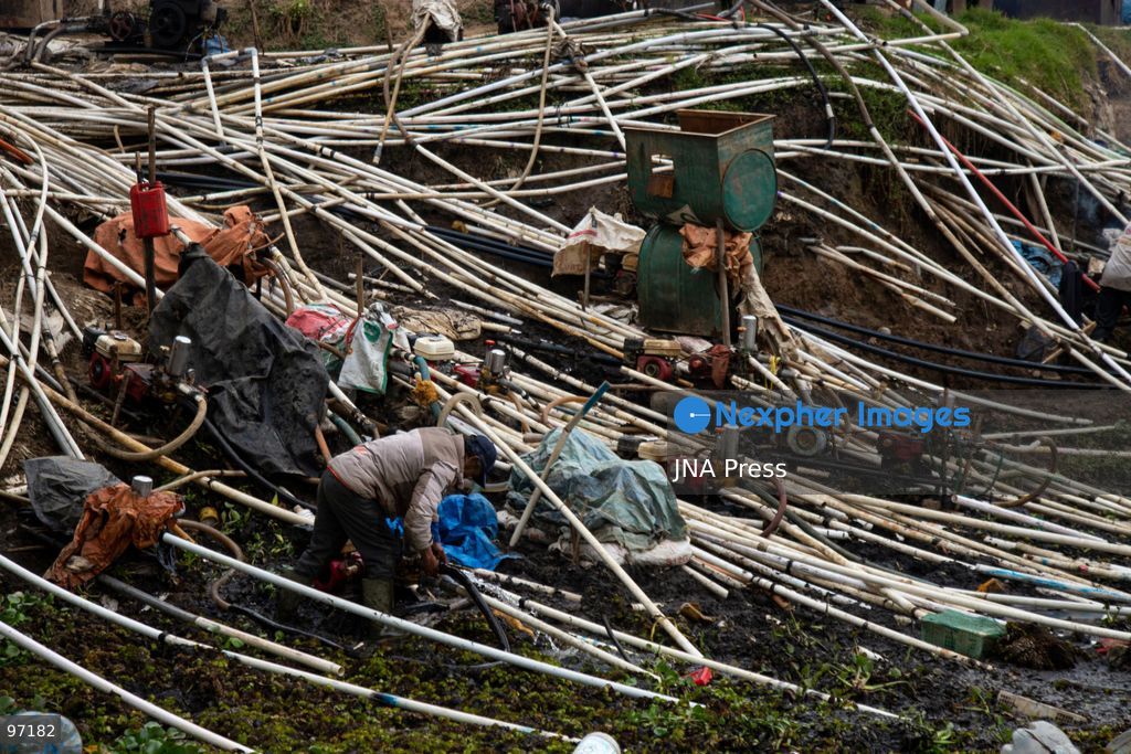 BANJARNEGARA, CENTRAL JAVA, INDONESIA, SEPTEMBER 26, 2026: Farmers use diesel-powered pumps and long hoses to draw water from Telaga Merdada for nearby farmland in Banjarnegara Regency, Central Java. The water level at the lake has dropped by approximately three meters over the past three months, increasing the need for farmers to pump water to irrigate agricultural land. Photo by Topen Anggara/ JNA Press. (Photo by Topen Anggara Saputra/JNA Press via Nexpher Images)
