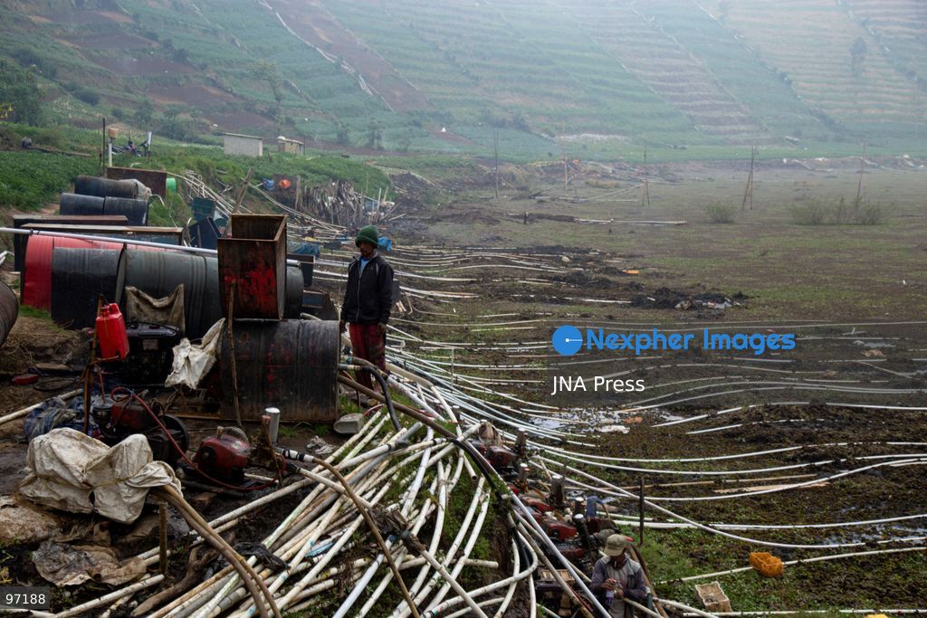 BANJARNEGARA, CENTRAL JAVA, INDONESIA, SEPTEMBER 26, 2026: Farmers use diesel-powered pumps and long hoses to draw water from Telaga Merdada for nearby farmland in Banjarnegara Regency, Central Java. The water level at the lake has dropped by approximately three meters over the past three months, increasing the need for farmers to pump water to irrigate agricultural land. Photo by Topen Anggara/ JNA Press. (Photo by Topen Anggara Saputra/JNA Press via Nexpher Images)