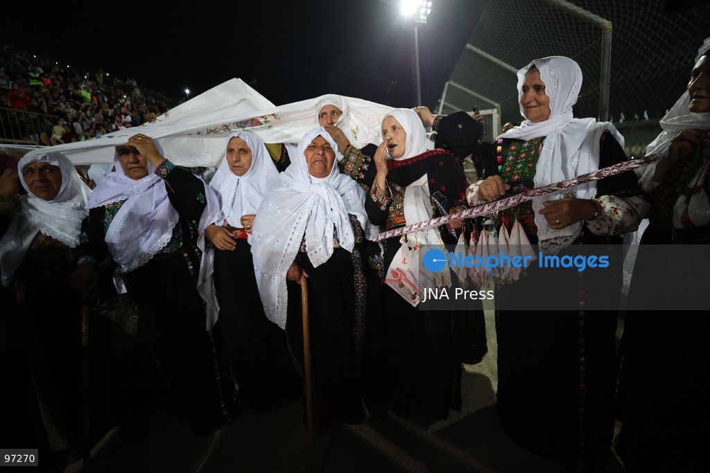 DURA, OCCUPIED WEST BANK, SEPTEMBER 26, 2026: Forty-four Palestinian brides and grooms take part in a mass wedding ceremony in Dura, south of Hebron, with participants wearing traditional Palestinian clothing. Dura Mayor Muhannad Amro said the collective wedding was organized to support couples facing difficult economic conditions amid the continuing impact of the war that began in October 2023. Photo by Mosab Shawer / JNA Press. (Photo by Mosab shawer/JNA Press via Nexpher Images)