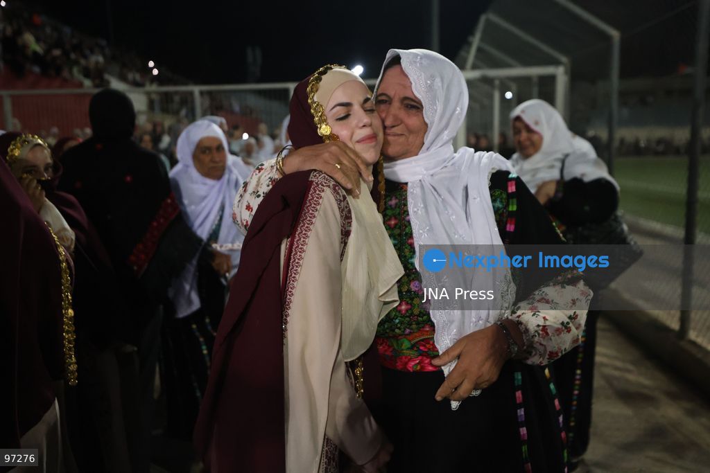 DURA, OCCUPIED WEST BANK, SEPTEMBER 26, 2026: Forty-four Palestinian brides and grooms take part in a mass wedding ceremony in Dura, south of Hebron, with participants wearing traditional Palestinian clothing. Dura Mayor Muhannad Amro said the collective wedding was organized to support couples facing difficult economic conditions amid the continuing impact of the war that began in October 2023. Photo by Mosab Shawer / JNA Press. (Photo by Mosab shawer/JNA Press via Nexpher Images)