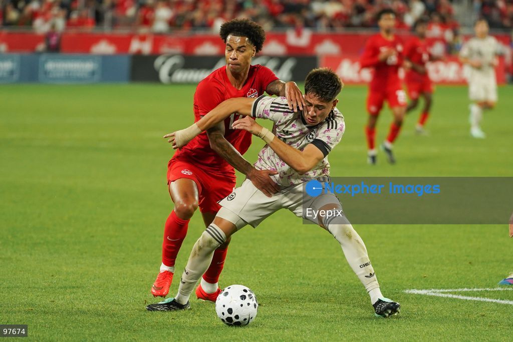 Tajon Buchanan #17 of Canada and Iván Román #04 of Chile battle for the ball during the International Friendly match between Canada and Chile at BMO Filed. on September 26, 2026 in Toronto, Ontario. (Photo by Leonardo Ramirez/ Eyepix Group) (Photo by Leonardo Ramirez/ Eyepix Group/Eyepix via Nexpher Images)