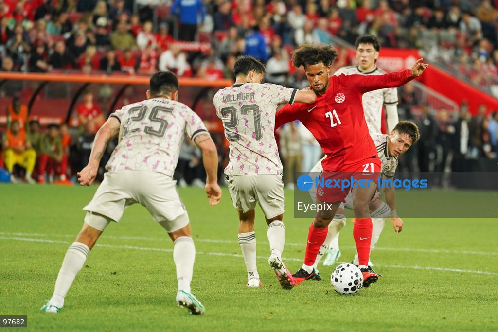Jacen Russell-Rowe #21 of Canada and Jonathan Villagra #27 of Chile battle for the ball during the International Friendly match between Canada and Chile at BMO Filed. on September 26, 2026 in Toronto, Ontario. (Photo by Leonardo Ramirez/ Eyepix Group) (Photo by Leonardo Ramirez/ Eyepix Group/Eyepix via Nexpher Images)