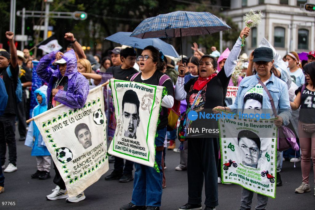 MEXICO CITY, MEXICO, SEPTEMBER 26, 2026: Families of the 43 missing Ayotzinapa students, students and human rights activists march through Mexico City to mark the 12th anniversary of the students’ disappearance and demand truth and justice. Thousands of demonstrators marched from the Ángel de la Independencia to the Zócalo, carrying photographs of the missing students and banners calling for answers over their fate. The 43 students from the Raúl Isidro Burgos Rural Teachers’ College disappeared in Iguala, Guerrero, on the night of September 26, 2014, and the case remains unresolved. Photo by Addi Setyawan / JNA Press. (Photo by addi setyawan/JNA Press via Nexpher Images)