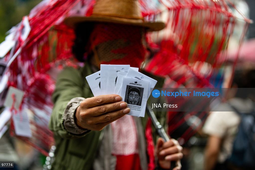 MEXICO CITY, MEXICO, SEPTEMBER 26, 2026: Families of the 43 missing Ayotzinapa students, students and human rights activists march through Mexico City to mark the 12th anniversary of the students’ disappearance and demand truth and justice. Thousands of demonstrators marched from the Ángel de la Independencia to the Zócalo, carrying photographs of the missing students and banners calling for answers over their fate. The 43 students from the Raúl Isidro Burgos Rural Teachers’ College disappeared in Iguala, Guerrero, on the night of September 26, 2014, and the case remains unresolved. Photo by Addi Setyawan / JNA Press. (Photo by addi setyawan/JNA Press via Nexpher Images)