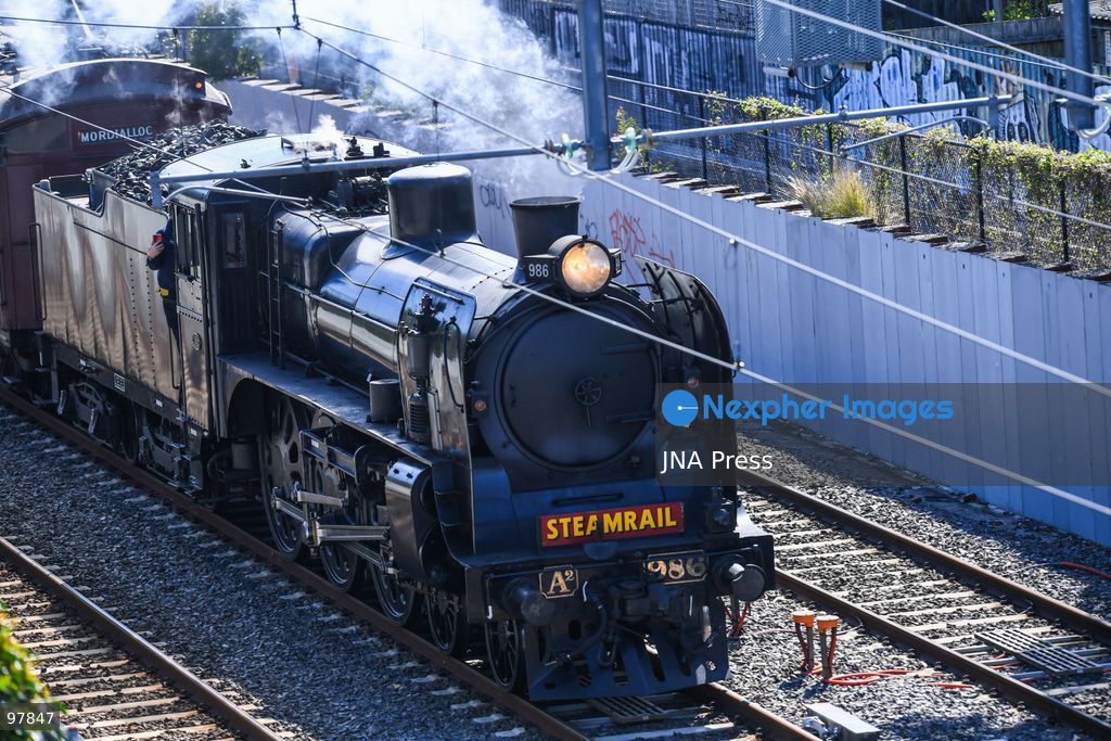 MELBOURNE, AUSTRALIA, SEPTEMBER 27, 2026: A historic A2 986 steam locomotive, built in 1915, pulls wooden Red Rattler carriages dating from 1908 along Melbourne’s Frankston line during a heritage rail journey organized by Steamrail Victoria. The special service gives passengers an opportunity to travel aboard preserved rolling stock from Victoria’s railway history. Photo by Alexander Bogatyrev / JNA Press. (Photo by Alexander Bogatyrev/JNA Press via Nexpher Images)