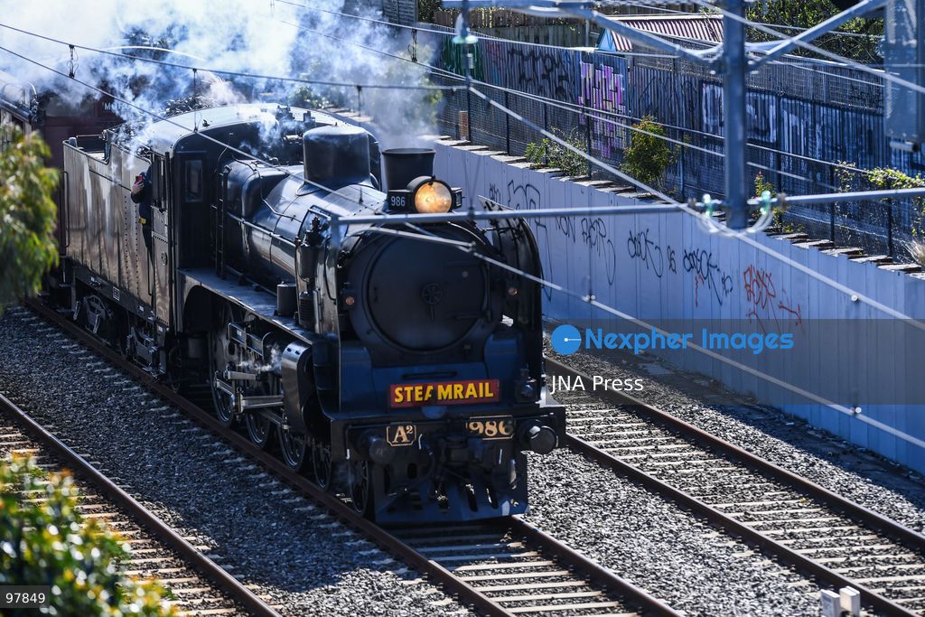 MELBOURNE, AUSTRALIA, SEPTEMBER 27, 2026: A historic A2 986 steam locomotive, built in 1915, pulls wooden Red Rattler carriages dating from 1908 along Melbourne’s Frankston line during a heritage rail journey organized by Steamrail Victoria. The special service gives passengers an opportunity to travel aboard preserved rolling stock from Victoria’s railway history. Photo by Alexander Bogatyrev / JNA Press. (Photo by Alexander Bogatyrev/JNA Press via Nexpher Images)