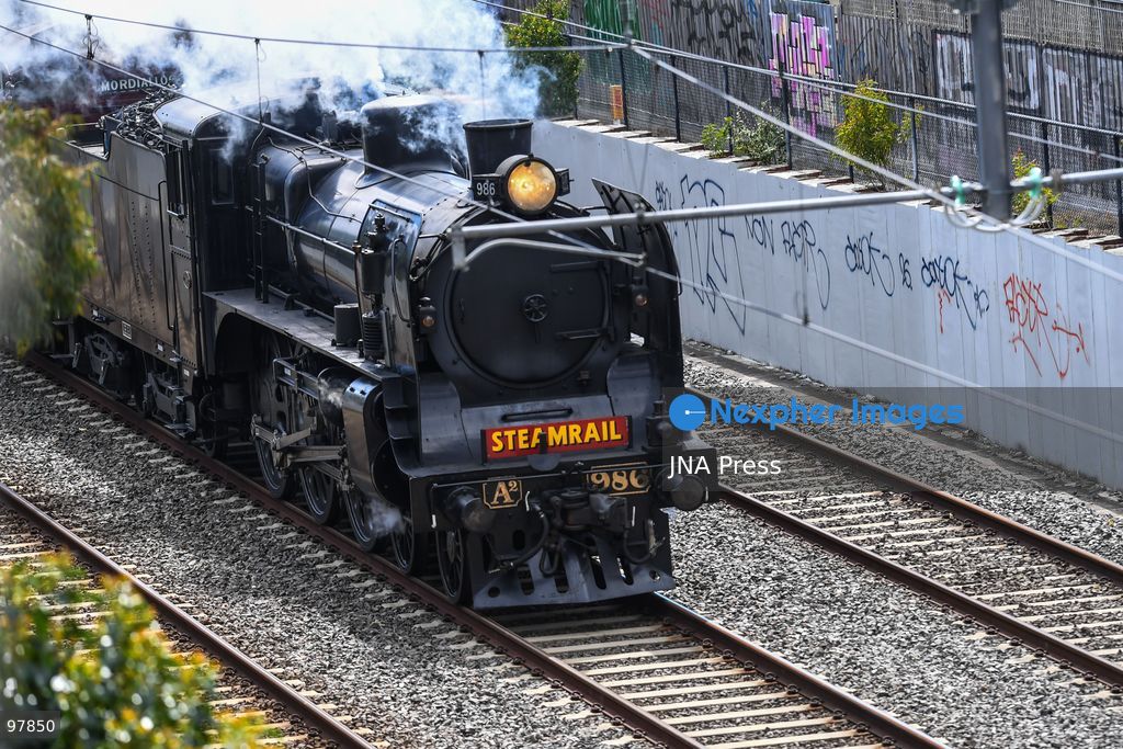 MELBOURNE, AUSTRALIA, SEPTEMBER 27, 2026: A historic A2 986 steam locomotive, built in 1915, pulls wooden Red Rattler carriages dating from 1908 along Melbourne’s Frankston line during a heritage rail journey organized by Steamrail Victoria. The special service gives passengers an opportunity to travel aboard preserved rolling stock from Victoria’s railway history. Photo by Alexander Bogatyrev / JNA Press. (Photo by Alexander Bogatyrev/JNA Press via Nexpher Images)