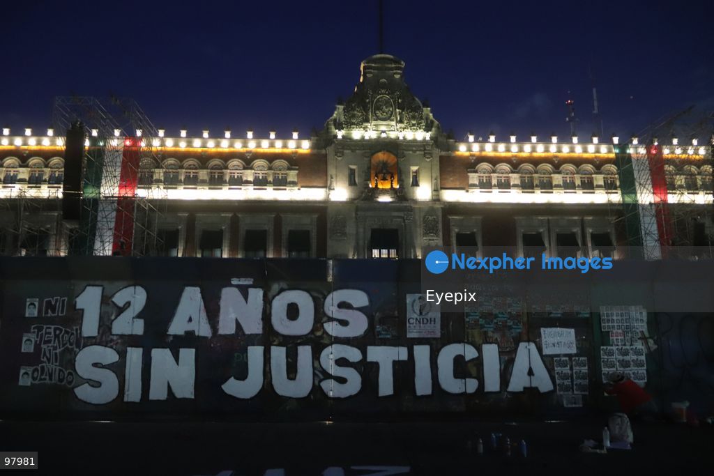 A protest message reading "12 years without justice" is seen painted on protective fences outside the National Palace during a rally to demand justice and truth on the 12th anniversary of the disappearance of the 43 students, in Mexico City, Mexico on September 26, 2026. (Photo by Carlos Santiago/ Eyepix Group) (Photo by Carlos Santiago/ Eyepix Group/Eyepix via Nexpher Images)