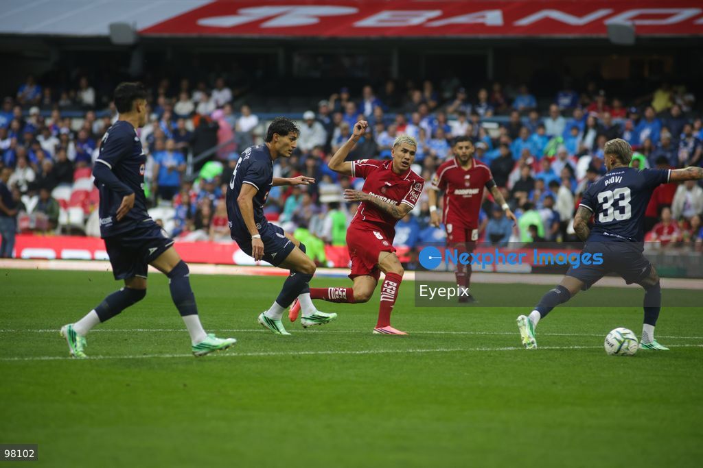 Gonzalo Piovi #33 of Cruz Azul stops the shot of Nicolas Castro #8 of Toluca during the 10th round match between Cruz Azul and Toluca as part of the Torneo Apertura 2026 Liga MX at Banorte Stadium on September 26, 2026 in Mexico City, Mexico. Final Score Cruz Azul 3-3 Toluca. (Photo by Ismael Rosas/ Eyepix Group) (Photo by Ismael Rosas/ Eyepix Group/Eyepix via Nexpher Images)