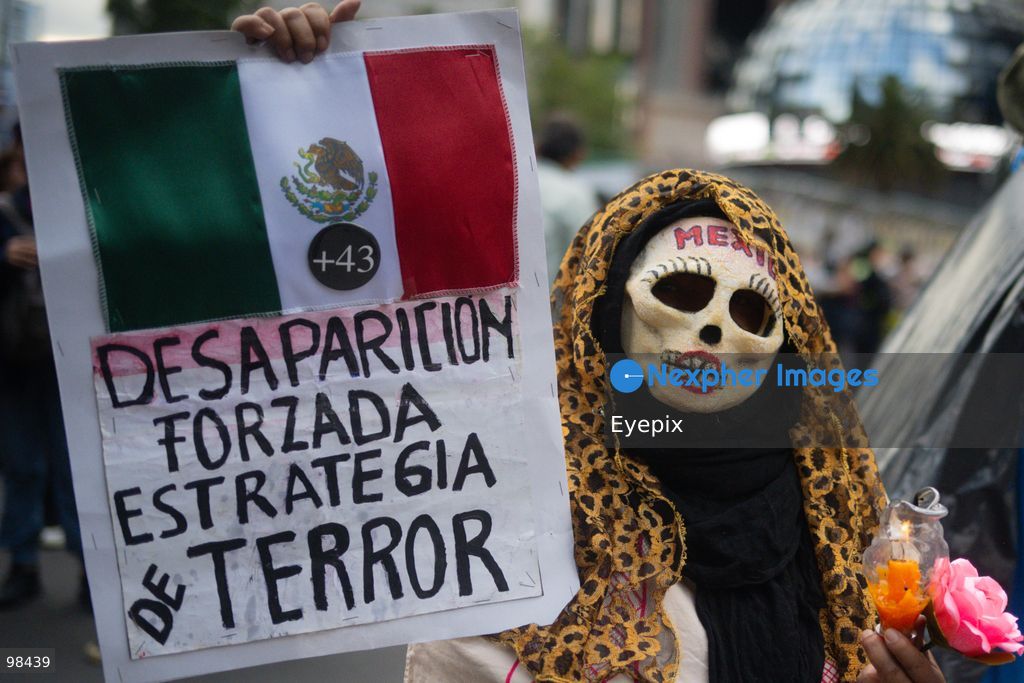 A person holds a placard while taking part during a rally to demand justice and truth on the 12th anniversary of the disappearance of the 43 students, in Mexico City, Mexico on September 26, 2026. (Photo by Marco Gonzalez/ Eyepix Group) (Photo by Marco Gonzalez/ Eyepix Group/Eyepix via Nexpher Images)