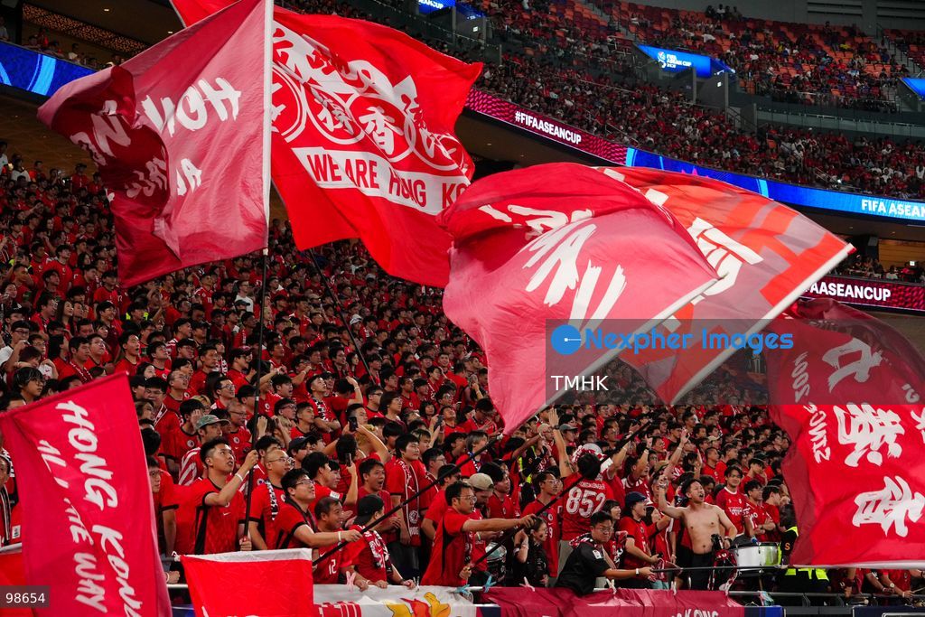 Passionate supporters wave red team colours, clap, and chant slogans to back Hong Kong, China during their FIFA ASEAN Cup Tier 2 match against Laos at Kai Tak Stadium on September 27, 2026 in Hong Kong, where a lively crowd of nearly 19,000 cheered on the home side. (Photo by Zulu Lo/TMHK via Nexpher Images)