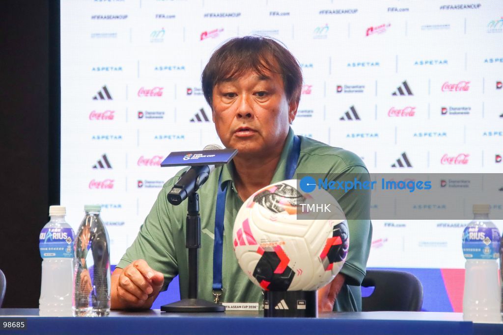A close-up headshot shows Cambodia head coach Koji Gyotoku speaking at the post-match press conference after securing a dramatic 1-0 victory over Myanmar in their FIFA ASEAN Cup Tier 2 encounter at Kai Tak Stadium on September 27, 2026 in Hong Kong. Gyotoku expressed his hope that his team could reach the final to take on a strong Hong Kong, China side. (Photo by Gordon Choi/TMHK via Nexpher Images)