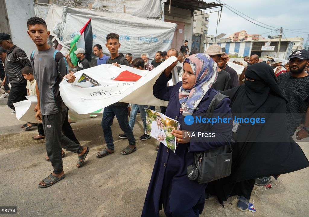 NUSEIRAT, GAZA STRIP, SEPTEMBER 29, 2026: Palestinians mourn during funeral ceremonies for victims whose remains were recovered from beneath the rubble of Al-Muhandisin Tower and other destroyed homes in the Nuseirat refugee camp in the central Gaza Strip. Recovery teams have been searching through the ruins of Al-Muhandisin Tower, which was destroyed during the war, as families prepare to bury relatives whose remains had been trapped beneath the rubble for an extended period. Photo by Ramzi Abu Amer / JNA Press. (Photo by Ramzi Abu Amer/JNA Press via Nexpher Images)
