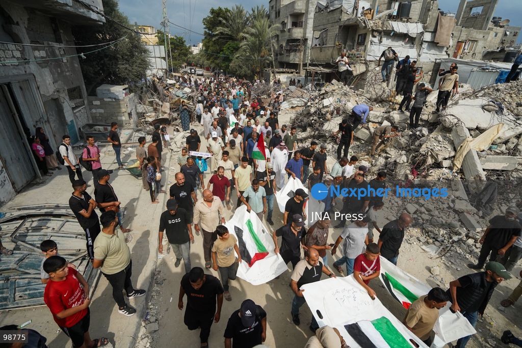 NUSEIRAT, GAZA STRIP, SEPTEMBER 29, 2026: Palestinians mourn during funeral ceremonies for victims whose remains were recovered from beneath the rubble of Al-Muhandisin Tower and other destroyed homes in the Nuseirat refugee camp in the central Gaza Strip. Recovery teams have been searching through the ruins of Al-Muhandisin Tower, which was destroyed during the war, as families prepare to bury relatives whose remains had been trapped beneath the rubble for an extended period. Photo by Ramzi Abu Amer / JNA Press. (Photo by Ramzi Abu Amer/JNA Press via Nexpher Images)