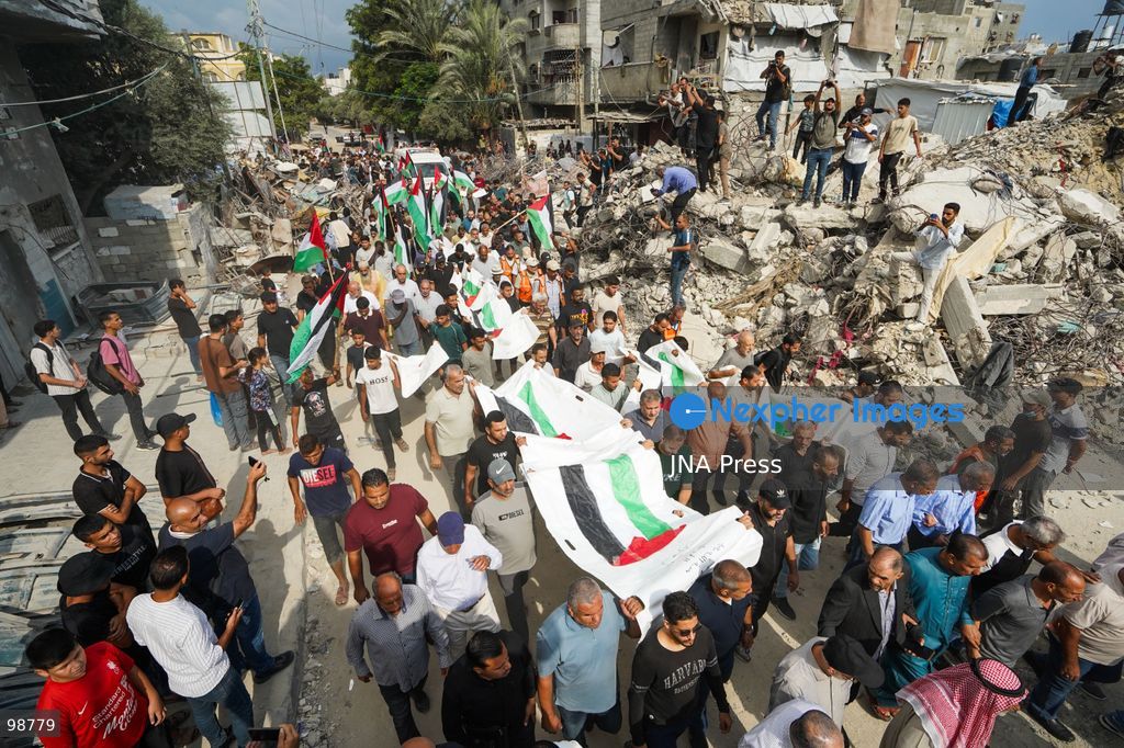NUSEIRAT, GAZA STRIP, SEPTEMBER 29, 2026: Palestinians mourn during funeral ceremonies for victims whose remains were recovered from beneath the rubble of Al-Muhandisin Tower and other destroyed homes in the Nuseirat refugee camp in the central Gaza Strip. Recovery teams have been searching through the ruins of Al-Muhandisin Tower, which was destroyed during the war, as families prepare to bury relatives whose remains had been trapped beneath the rubble for an extended period. Photo by Ramzi Abu Amer / JNA Press. (Photo by Ramzi Abu Amer/JNA Press via Nexpher Images)