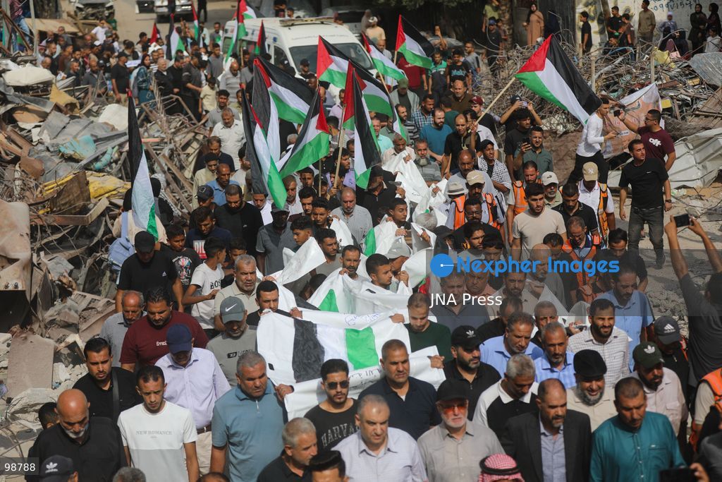 NUSEIRAT, GAZA STRIP, SEPTEMBER 29, 2026: Palestinians mourn during funeral ceremonies for victims whose remains were recovered from beneath the rubble of Al-Muhandisin Tower and other destroyed homes in the Nuseirat refugee camp in the central Gaza Strip. Recovery teams have been searching through the ruins of Al-Muhandisin Tower, which was destroyed during the war, as families prepare to bury relatives whose remains had been trapped beneath the rubble for an extended period. Photo by Ramzi Abu Amer / JNA Press. (Photo by Ramzi Abu Amer/JNA Press via Nexpher Images)