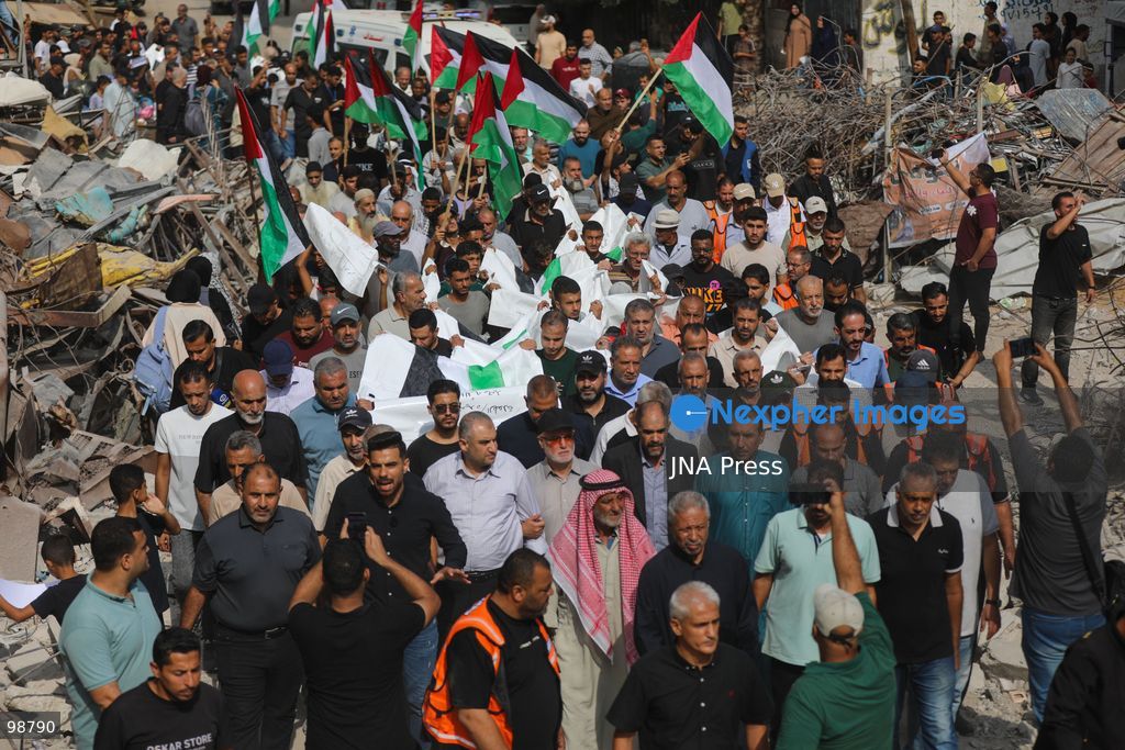 NUSEIRAT, GAZA STRIP, SEPTEMBER 29, 2026: Palestinians mourn during funeral ceremonies for victims whose remains were recovered from beneath the rubble of Al-Muhandisin Tower and other destroyed homes in the Nuseirat refugee camp in the central Gaza Strip. Recovery teams have been searching through the ruins of Al-Muhandisin Tower, which was destroyed during the war, as families prepare to bury relatives whose remains had been trapped beneath the rubble for an extended period. Photo by Ramzi Abu Amer / JNA Press. (Photo by Ramzi Abu Amer/JNA Press via Nexpher Images)