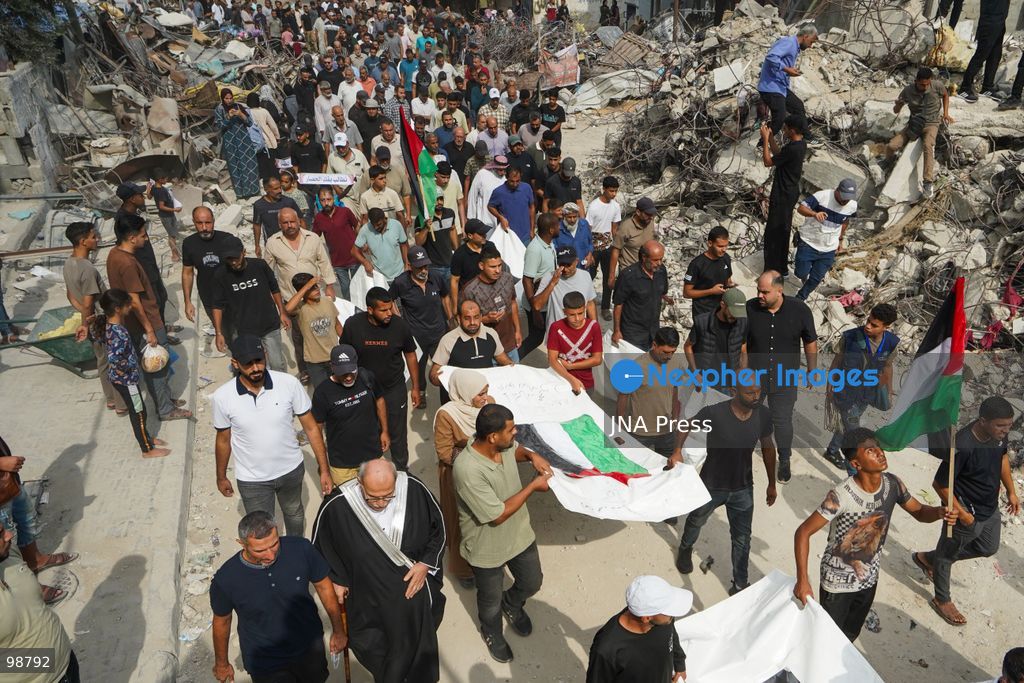 NUSEIRAT, GAZA STRIP, SEPTEMBER 29, 2026: Palestinians mourn during funeral ceremonies for victims whose remains were recovered from beneath the rubble of Al-Muhandisin Tower and other destroyed homes in the Nuseirat refugee camp in the central Gaza Strip. Recovery teams have been searching through the ruins of Al-Muhandisin Tower, which was destroyed during the war, as families prepare to bury relatives whose remains had been trapped beneath the rubble for an extended period. Photo by Ramzi Abu Amer / JNA Press. (Photo by Ramzi Abu Amer/JNA Press via Nexpher Images)